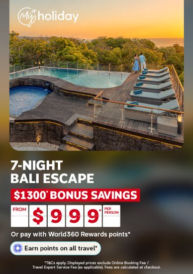 Couple admiring the sunset from an infinity pool deck overlooking the ocean for a 7-night Bali escape with 1300 bonus savings from 999 per person