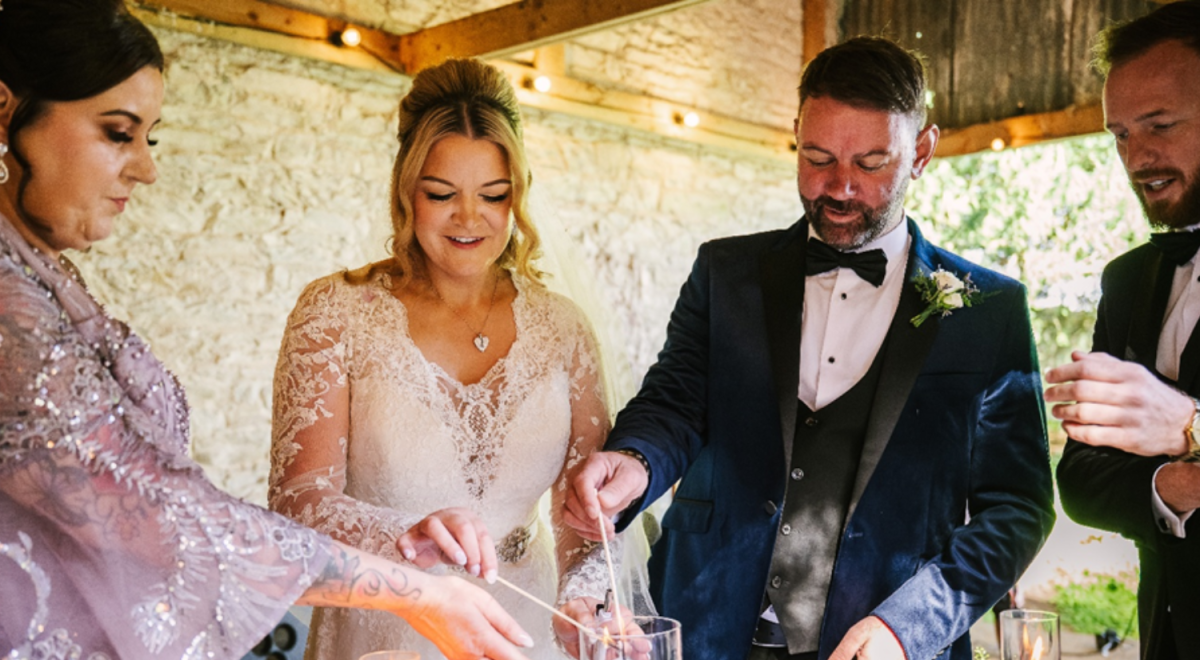 Bride (Geraldine) and Groom (Tom) light a candle as part of their wedding ceremony in Dublin 