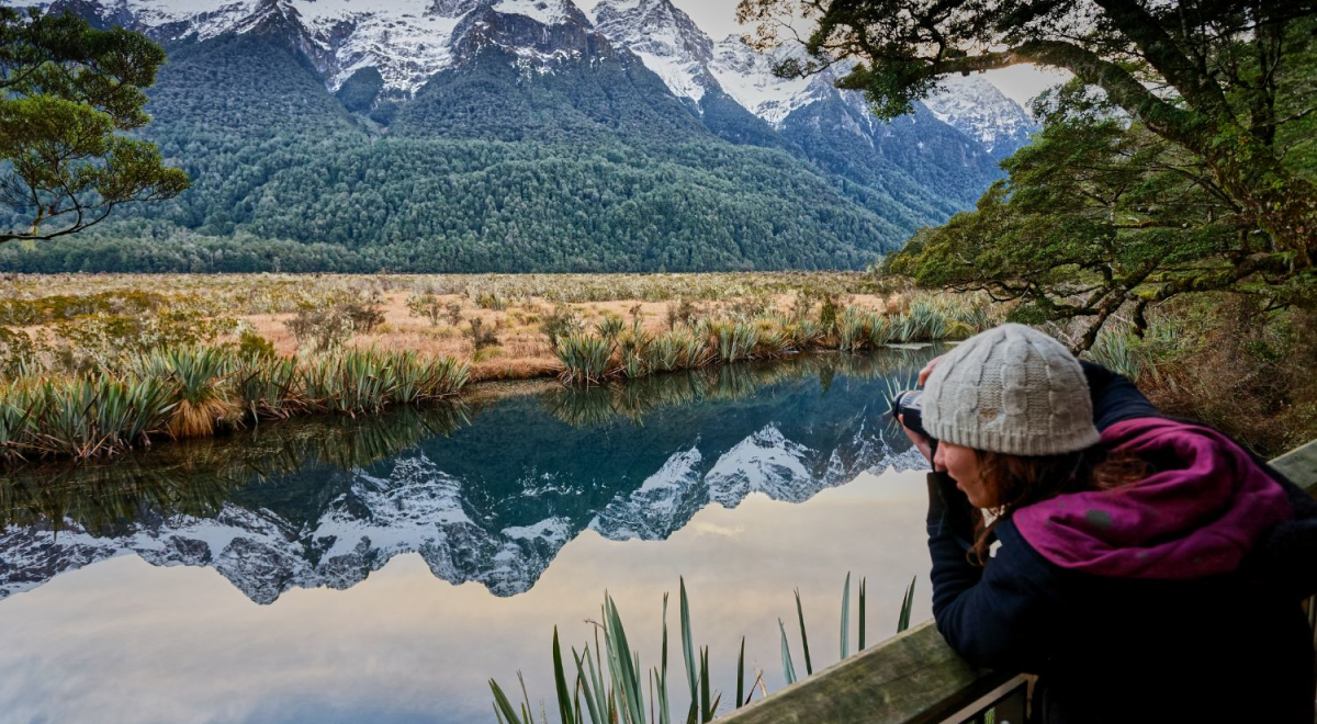 Traveller taking photo of Mirror Lakes