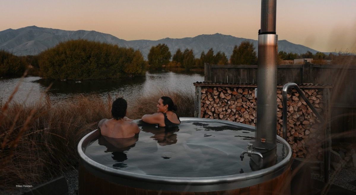 Travellers soaking in a hot tub in New Zealand