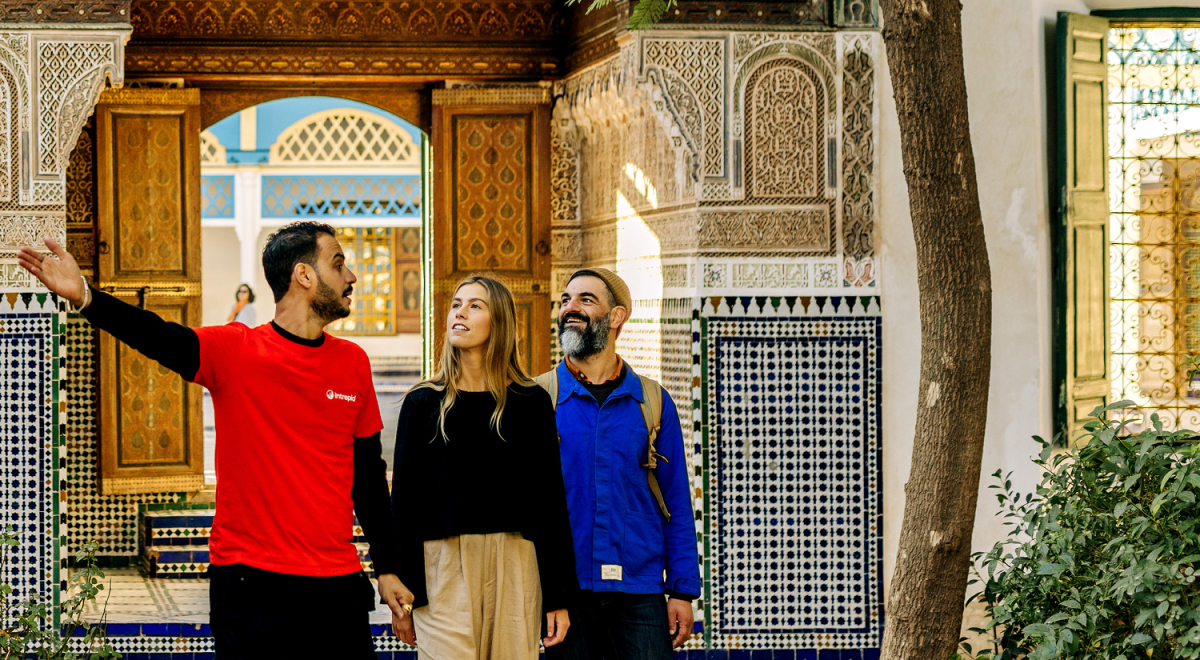 A guide and travellers on Intrepid's Classic Morocco tour
