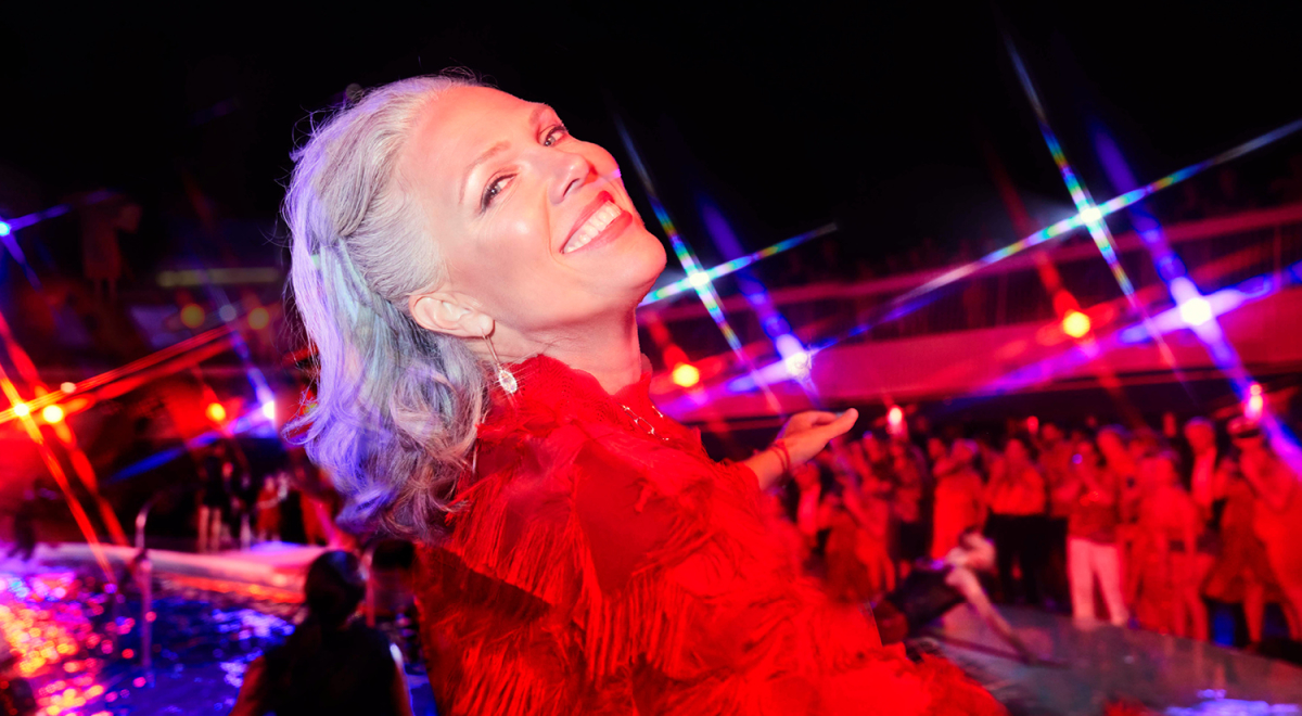 A woman enjoying the nightlife on a cruise ship