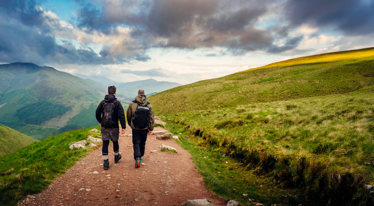 Two people hiking in the Scottish Highlands