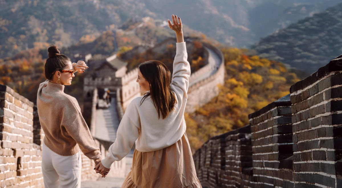 Couple walking on the Great Wall of China