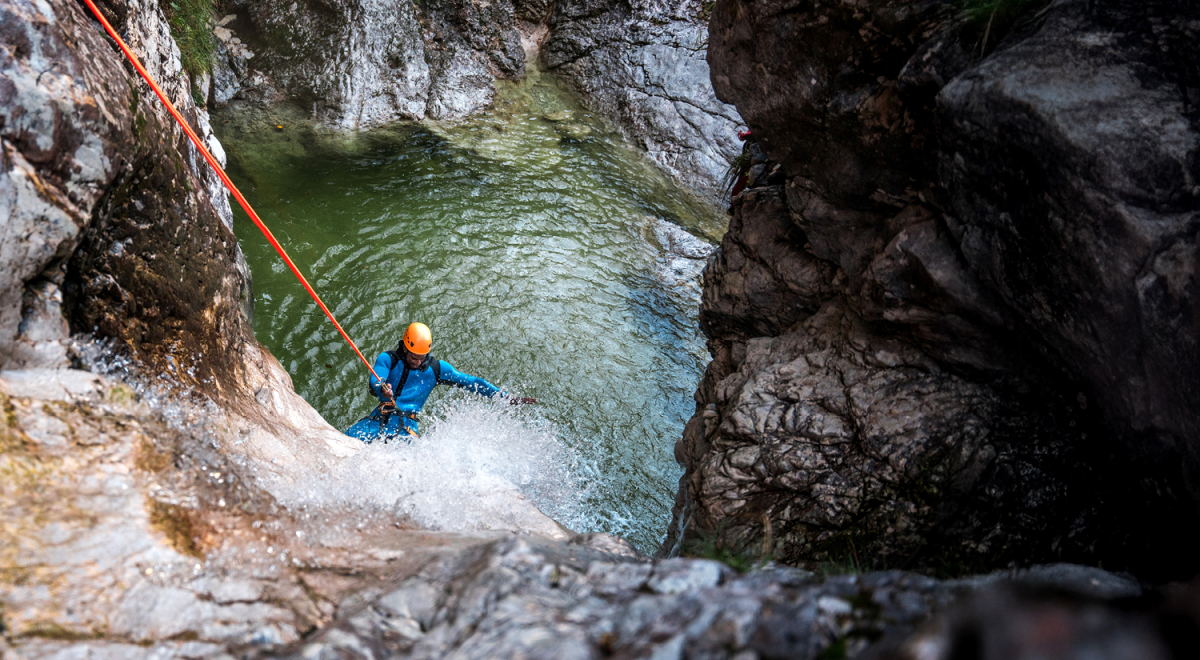 A traveller canyoneering on a cruise shore excursion