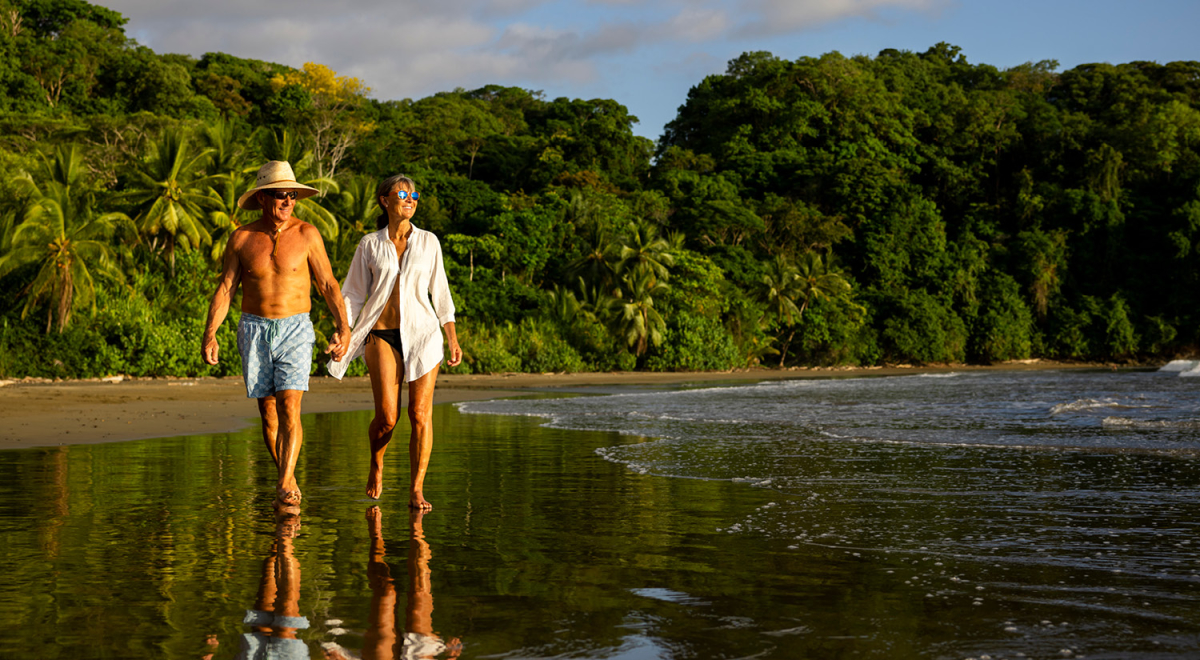 Couple walking on a beach in Costa Rica