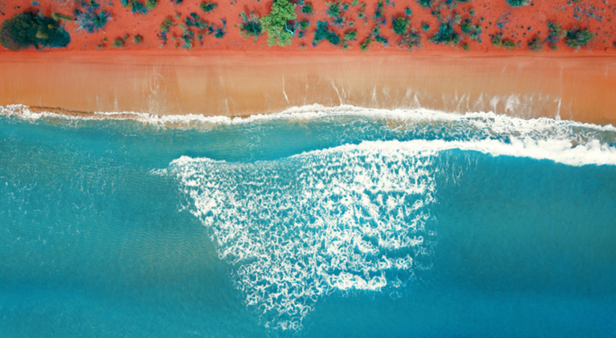 Natural bright orange sandy beach from above