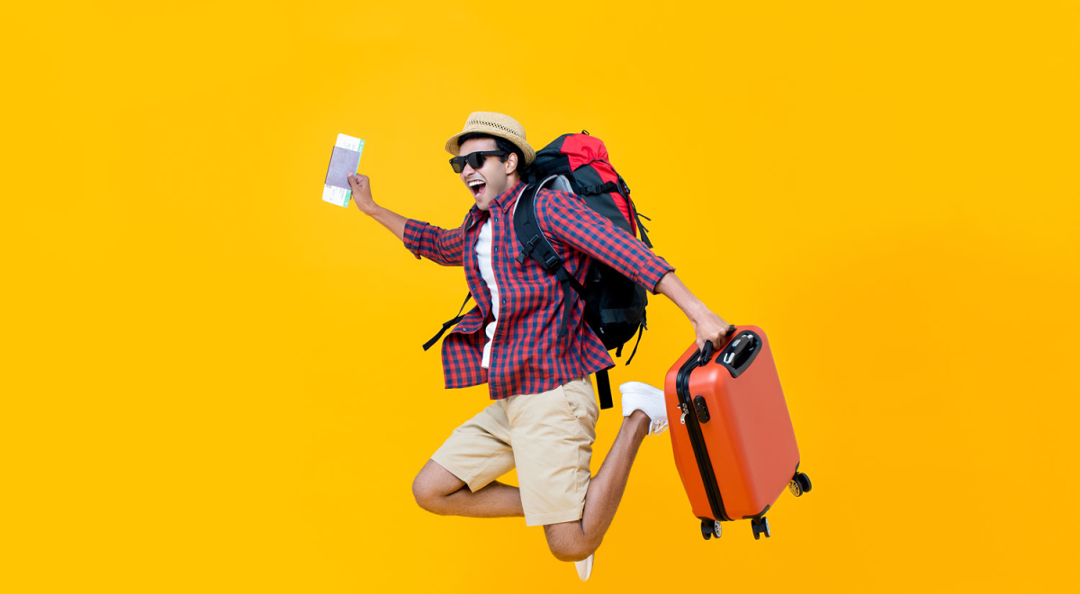 Happy-Asian-man-with-air-ticket-jumping