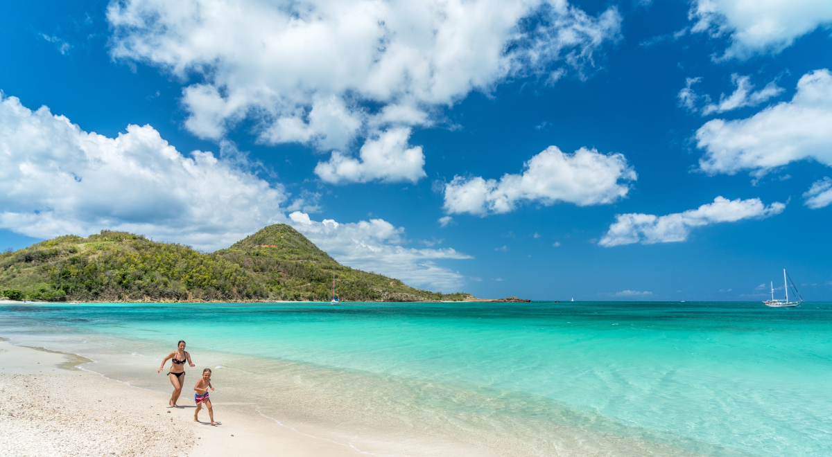 mother and son running on beach