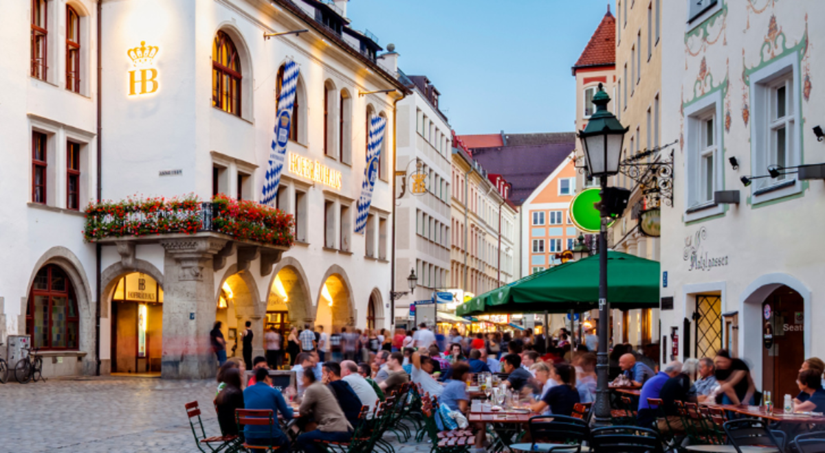 A town square in Munich during spring with people gathering