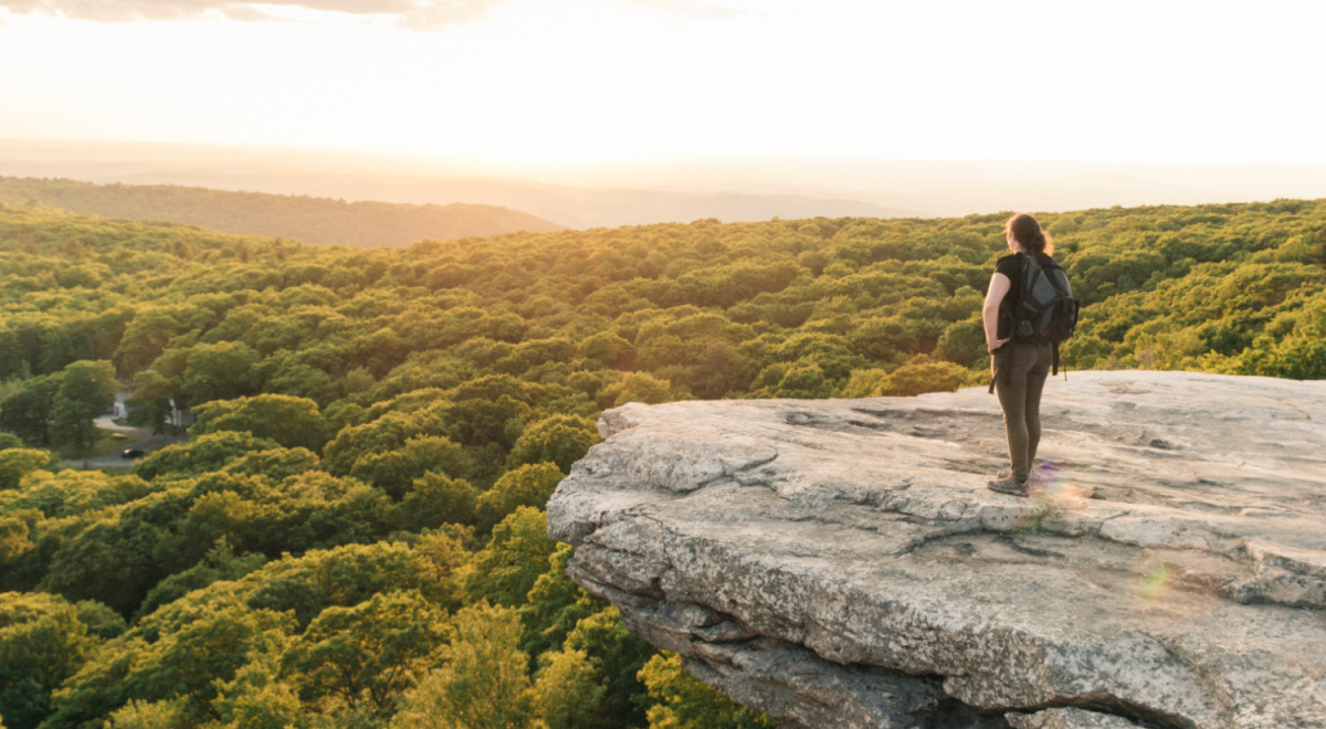 Hiking Woman Enjoys Sunset Catskills Mountain View in New York State