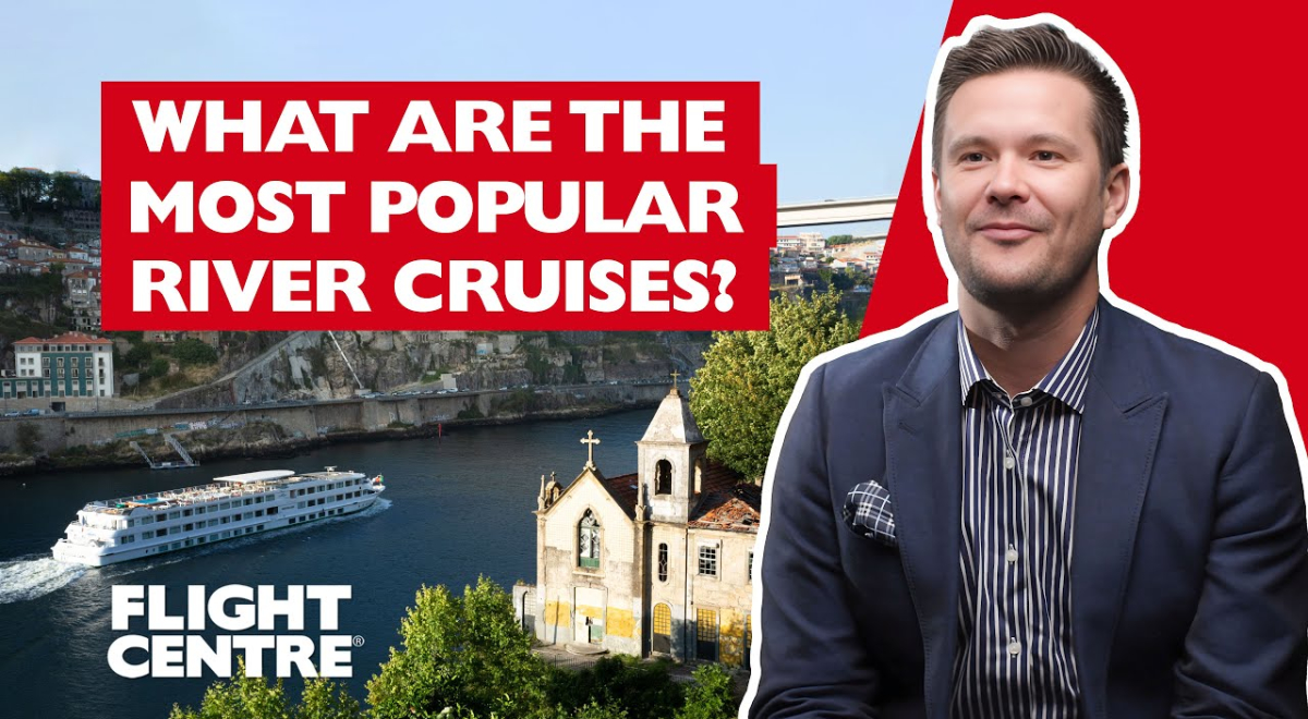 Man next to aerial image of city over water