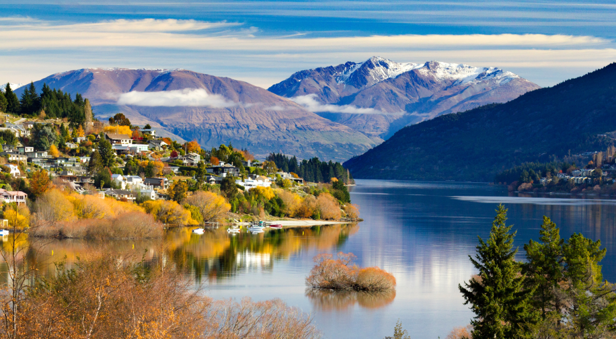 The edge of a lakeside suburb of Queenstown viewed over lake Wakatipu and the m