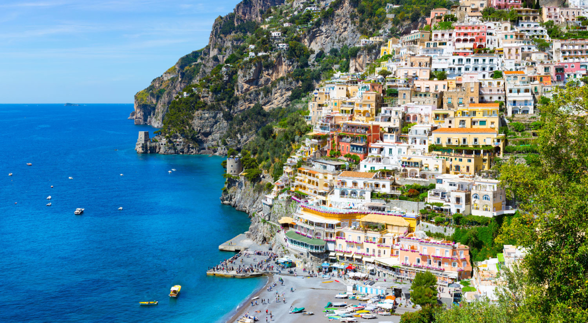 Positano, Amalfi Coast, Campania, Sorrento, Italy. View of the town and the seaside in a summer sunset