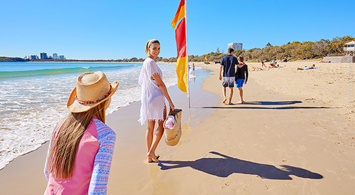 People walking along a beach