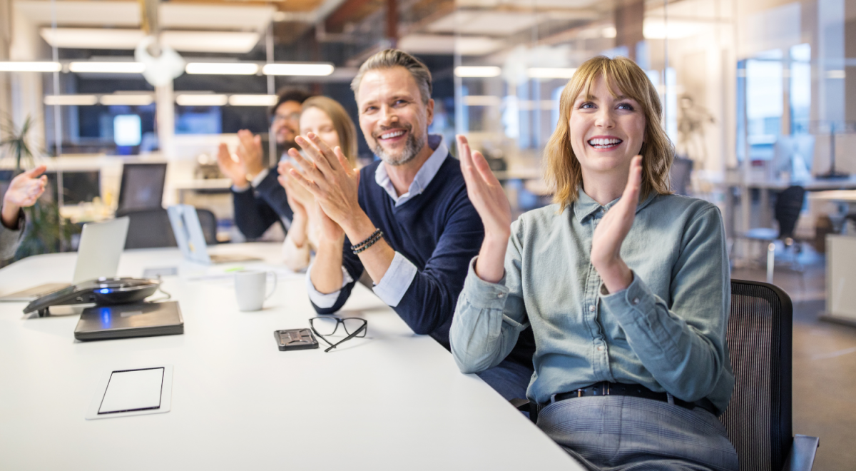 People at a meeting cheering