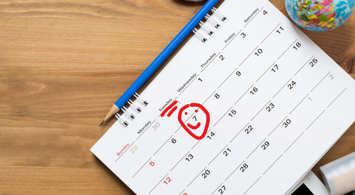 Tuesday marked on a calendar with a red smiley face
