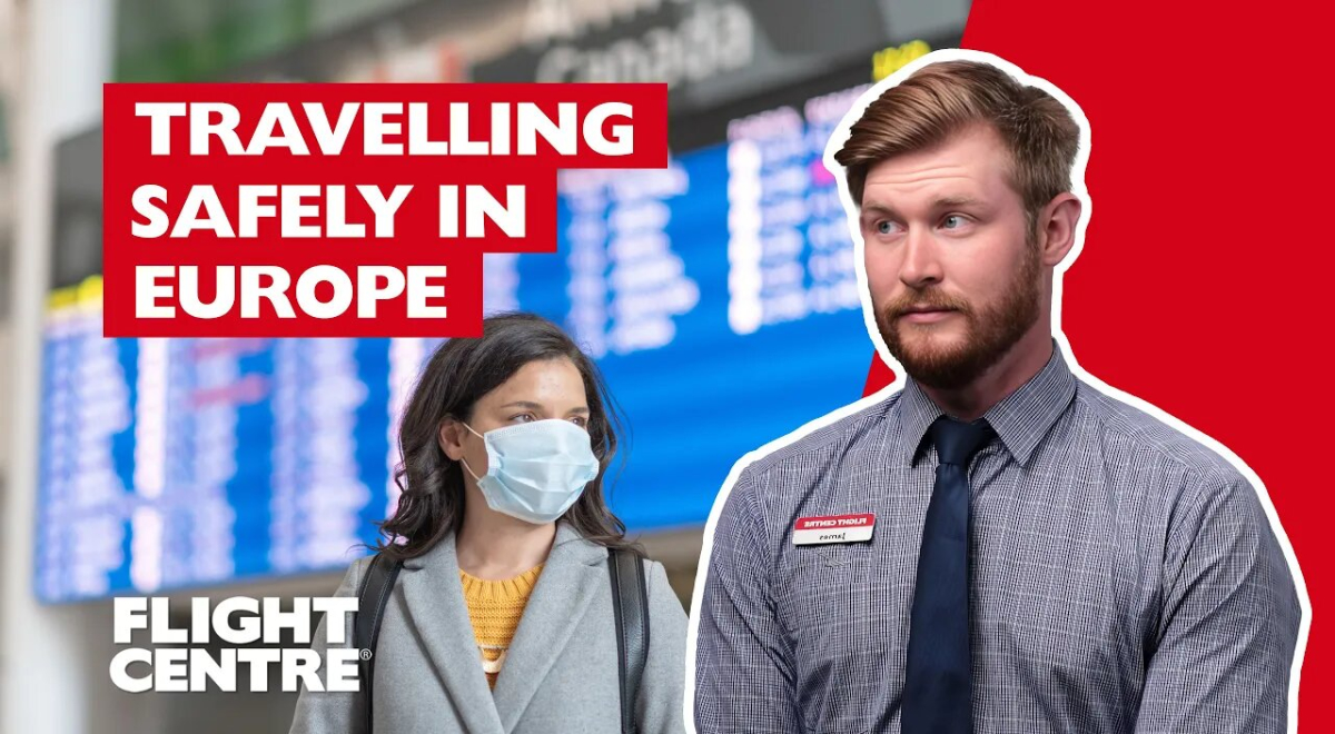 Man sitting down with woman in mask at an airport in background