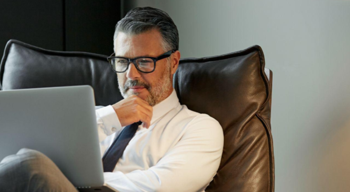 man using laptop at office