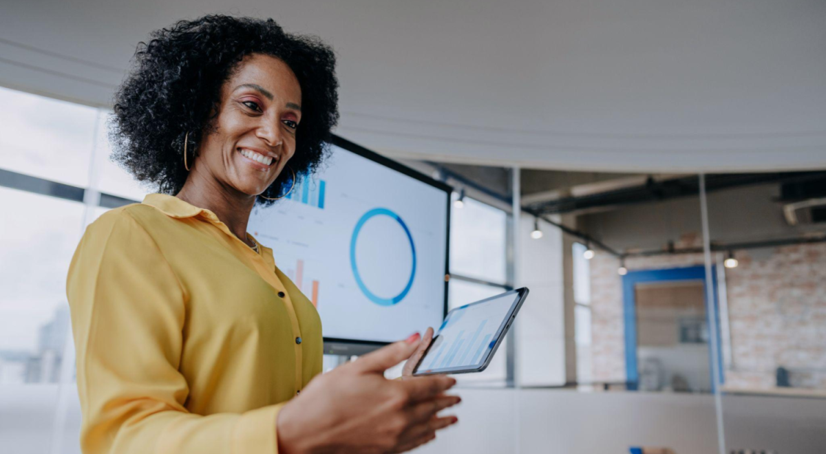 lady in yellow shirt holding phone 