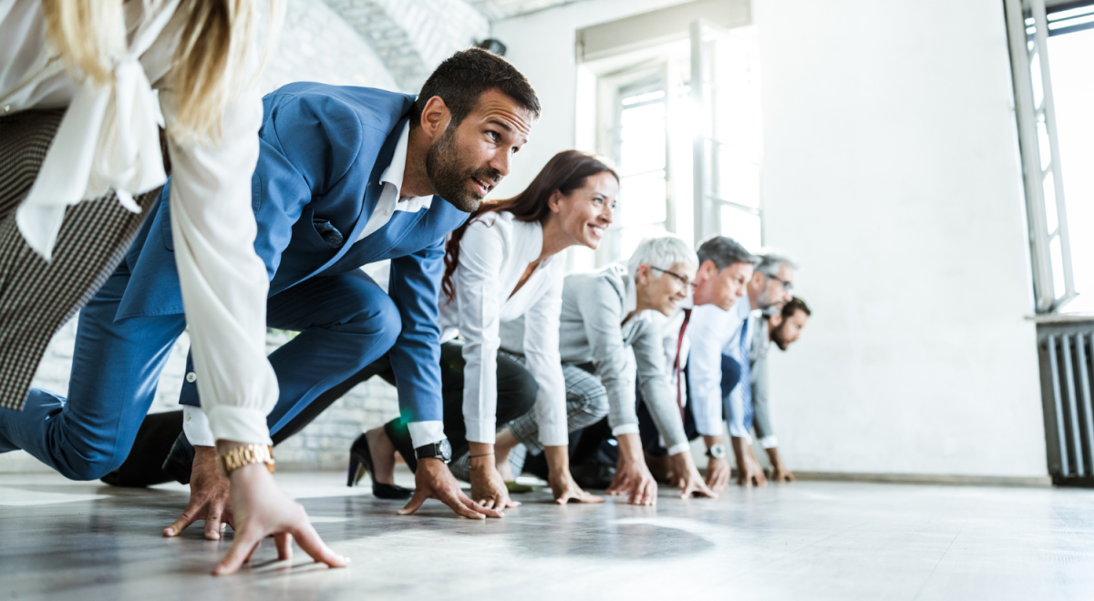 people in business suits getting ready to race