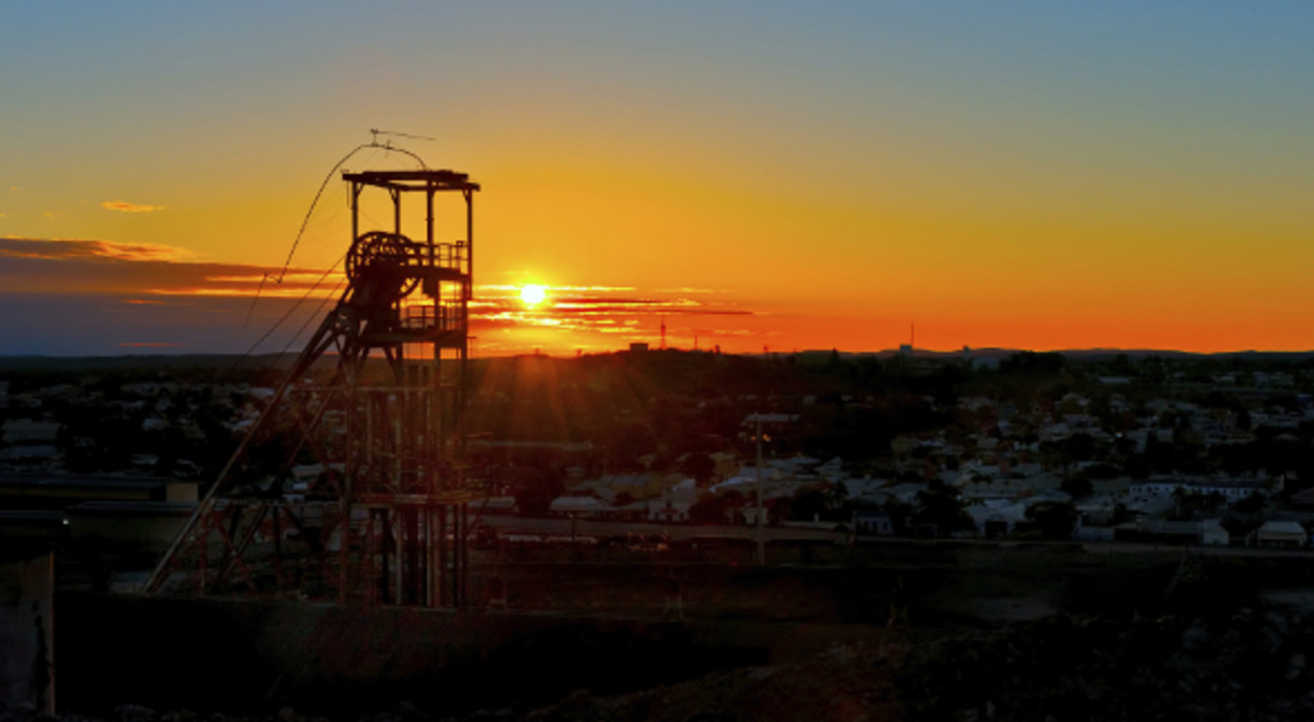 view of the sun setting over a town 