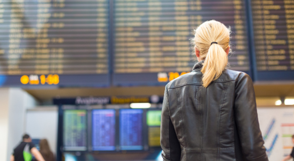 Lady looking at the flight check board