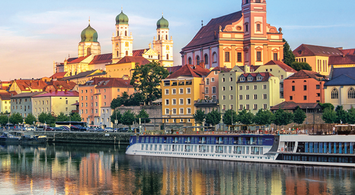 APT river cruise ship docked near Passau, Germany at sunset. 