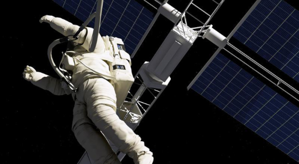Astronaut in a white space suite floating through space past the International Space Station