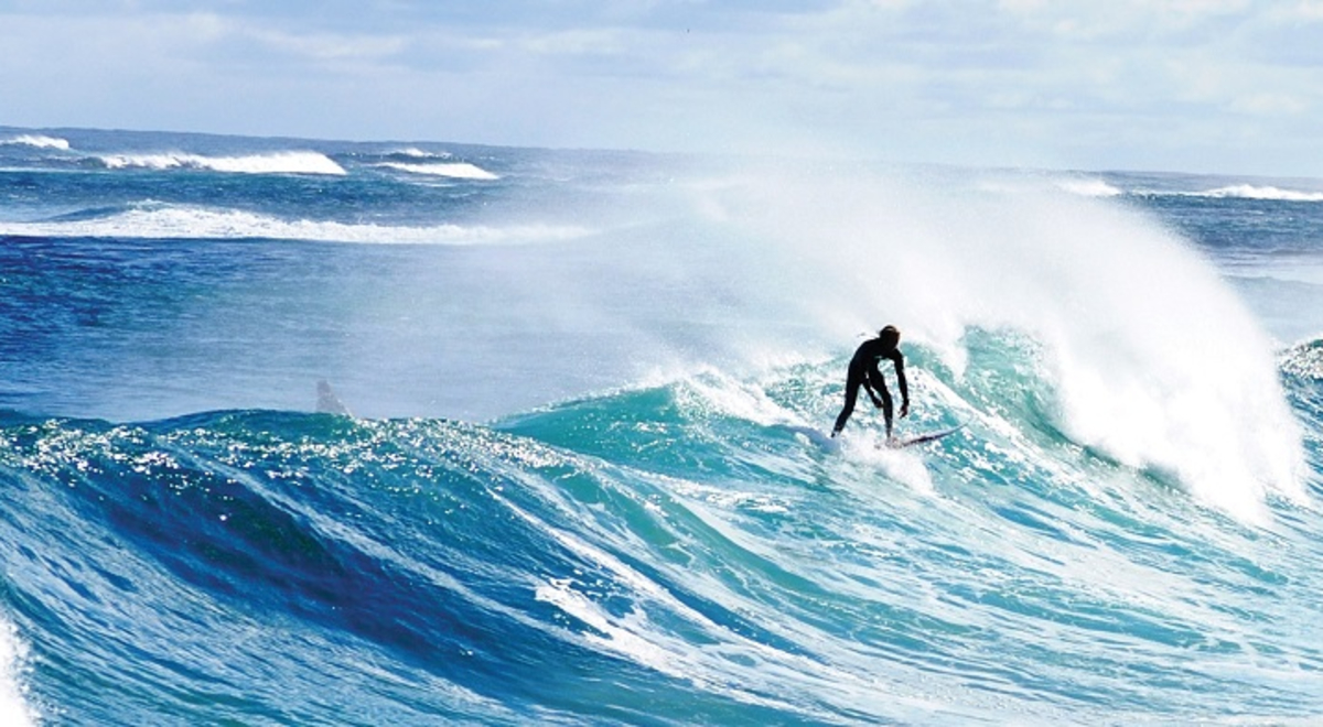 Surfer catching a big wave