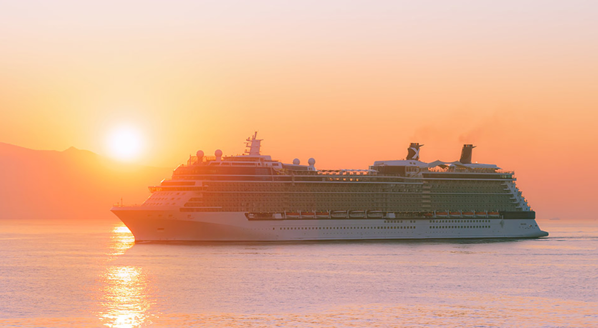 A Cruise ship venturing on the ocean during sunset
