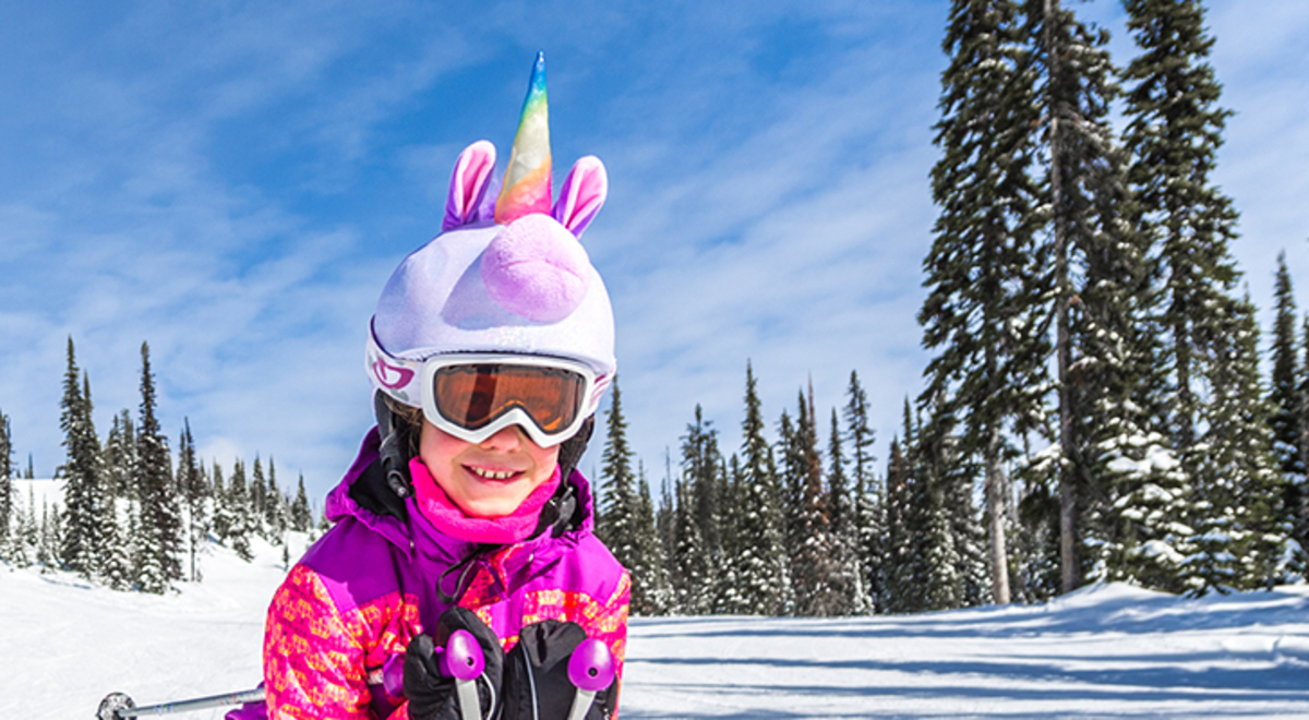 girl skiing on the slopes at Big White Cananda, dressed as a unicorn. Credit: Big White Ski Resort
