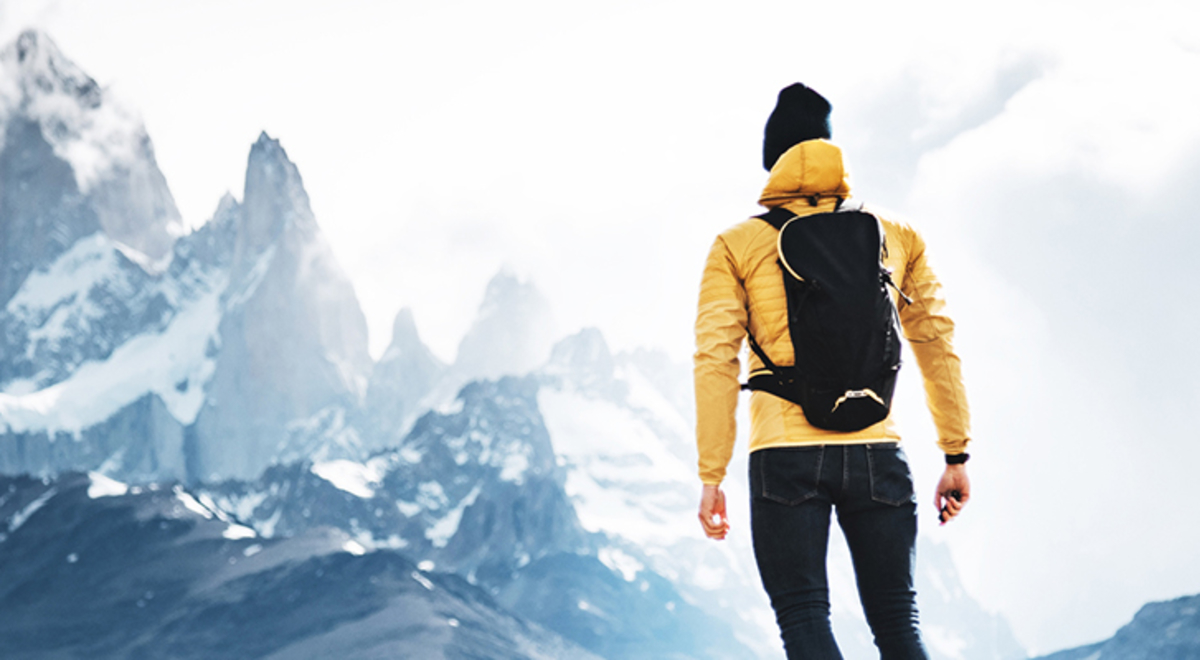 A hiker looks at the looming El Chatan Peak in Patagonia
