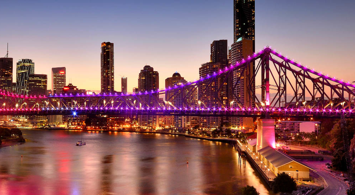 Brisbane's skyline, featuring the Story Bridge, at twilight.