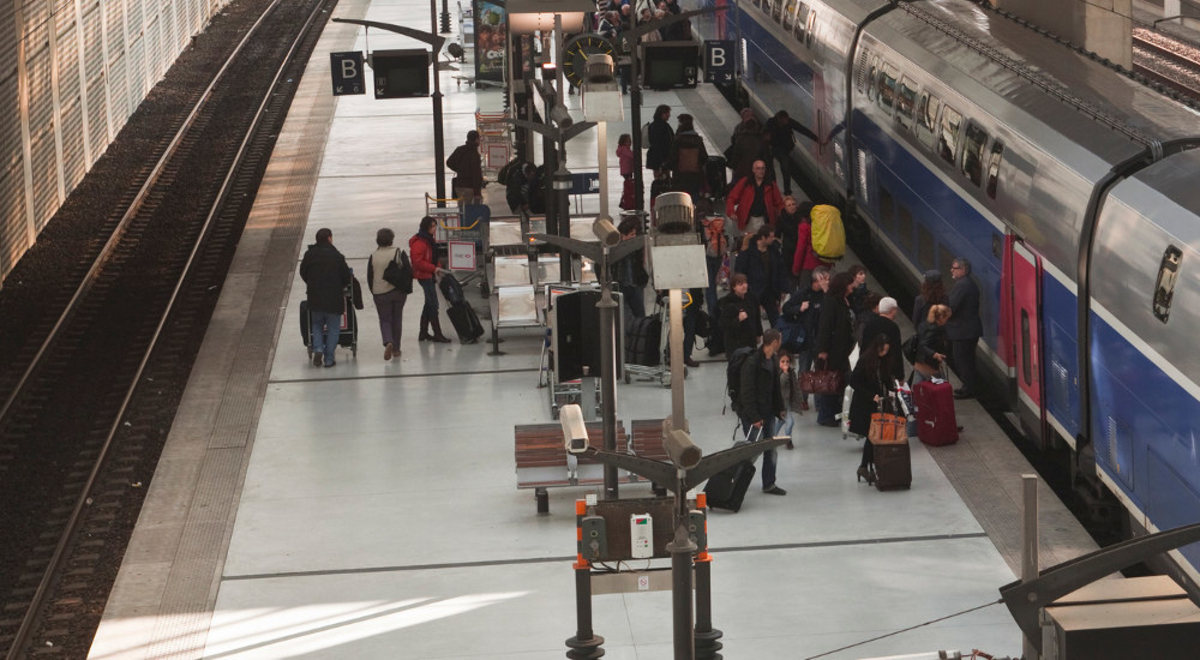 Passengers at the terminal aboard the SNCF train