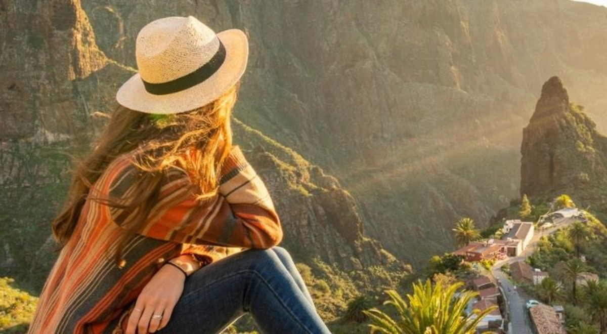 Lady savoring the view from the top of the hill