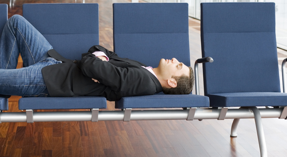 Man asleep in the airport lounge 