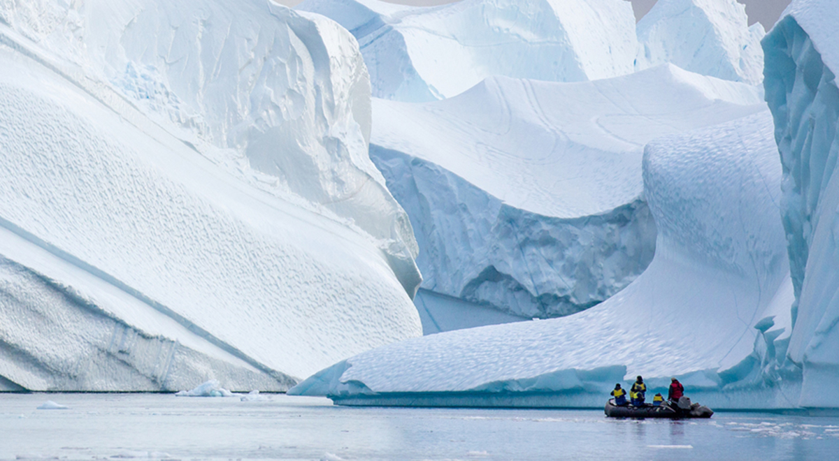 greenland expedition zodiac infront of icebergs