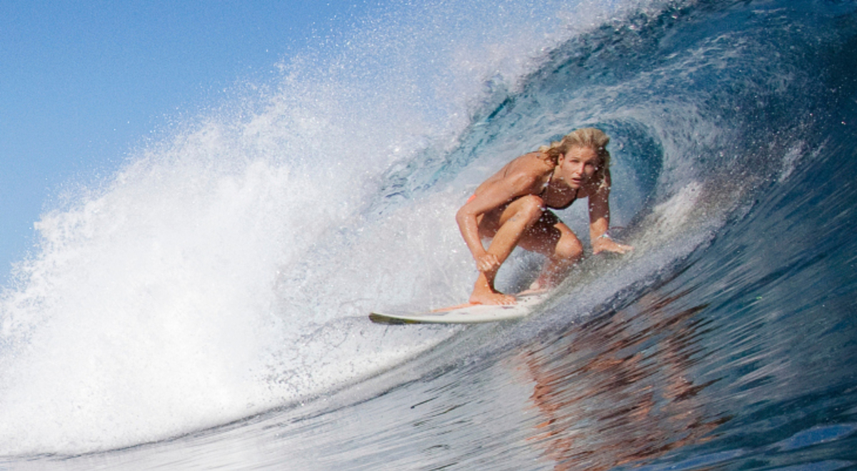 Surfer under a wave in the ocean