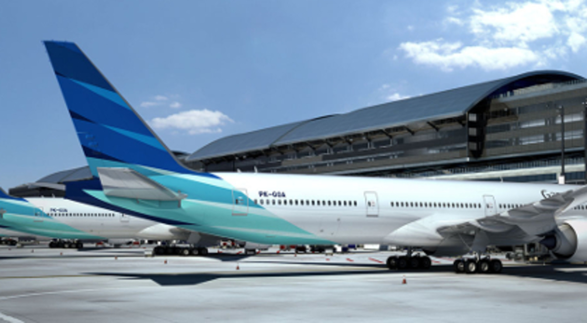 Some Garuda Indonesia planes lined up at the gates