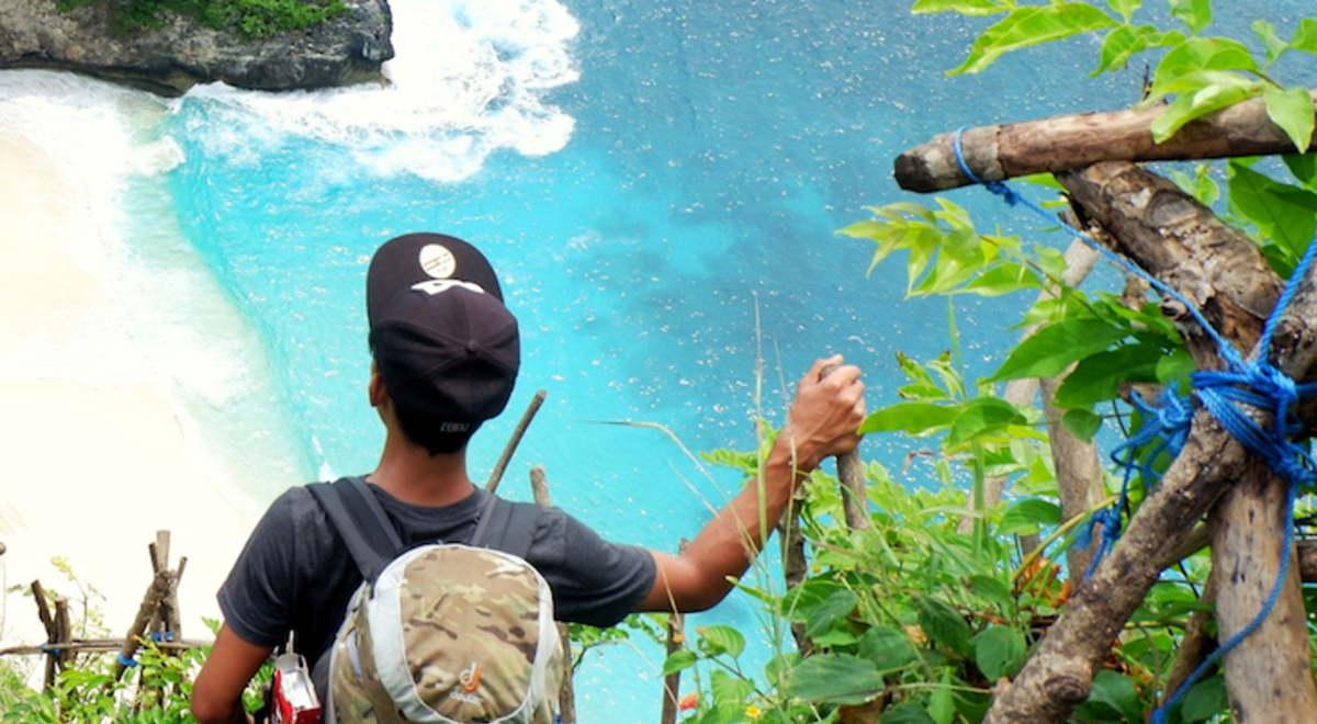 a man looking down a lagoon 