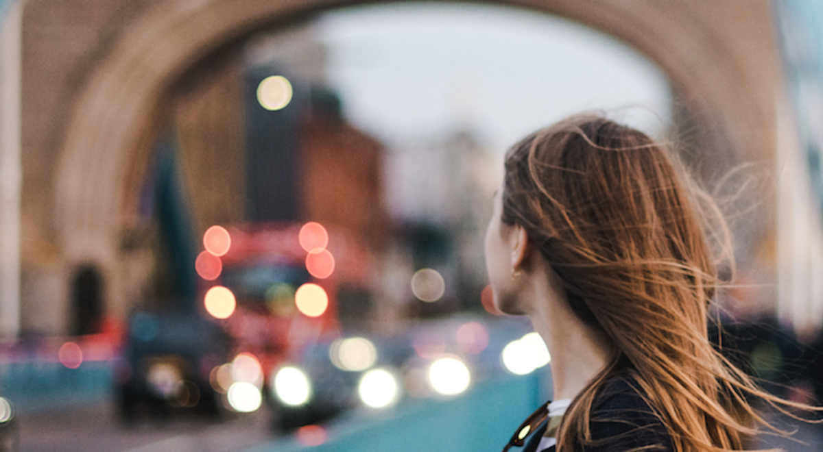 Lady stood along the Tower Bridge in London