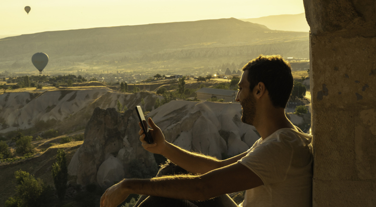Man admiring the hot air balloon view 