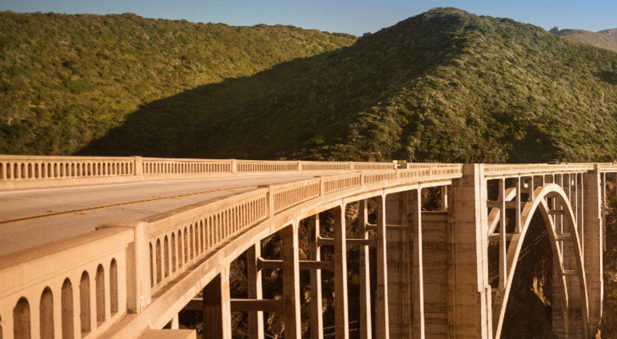 Long railroad bridge connecting two hills