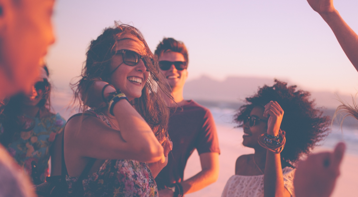 People wearing sunglasses and having a beach party