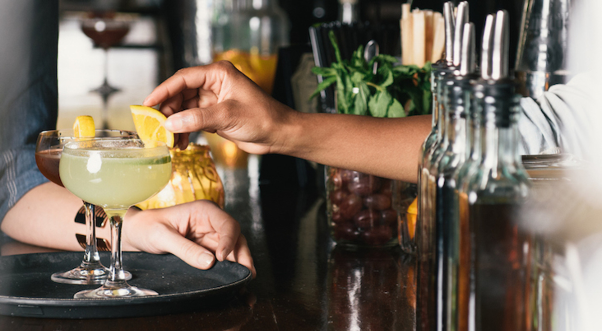 NYC cocktail being served at a bar