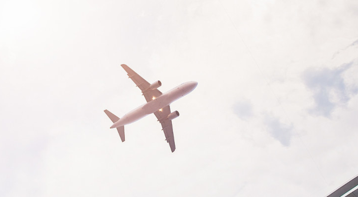 View of plane flying from the ground 