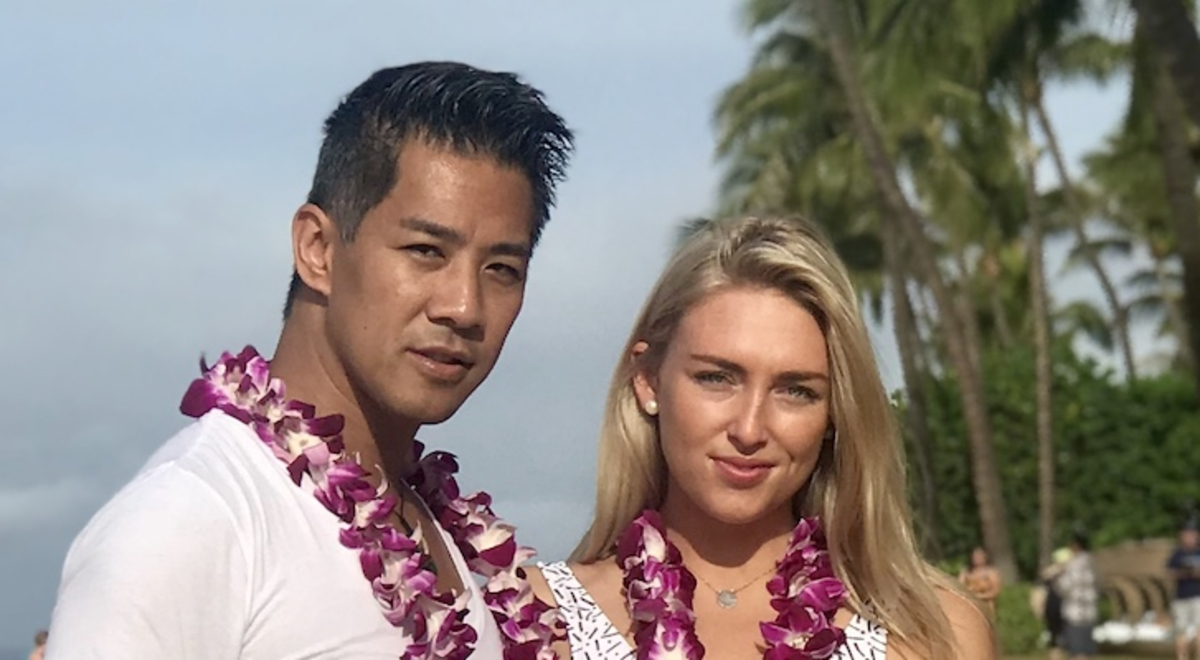 Couple at the beach with natural flower necklaces