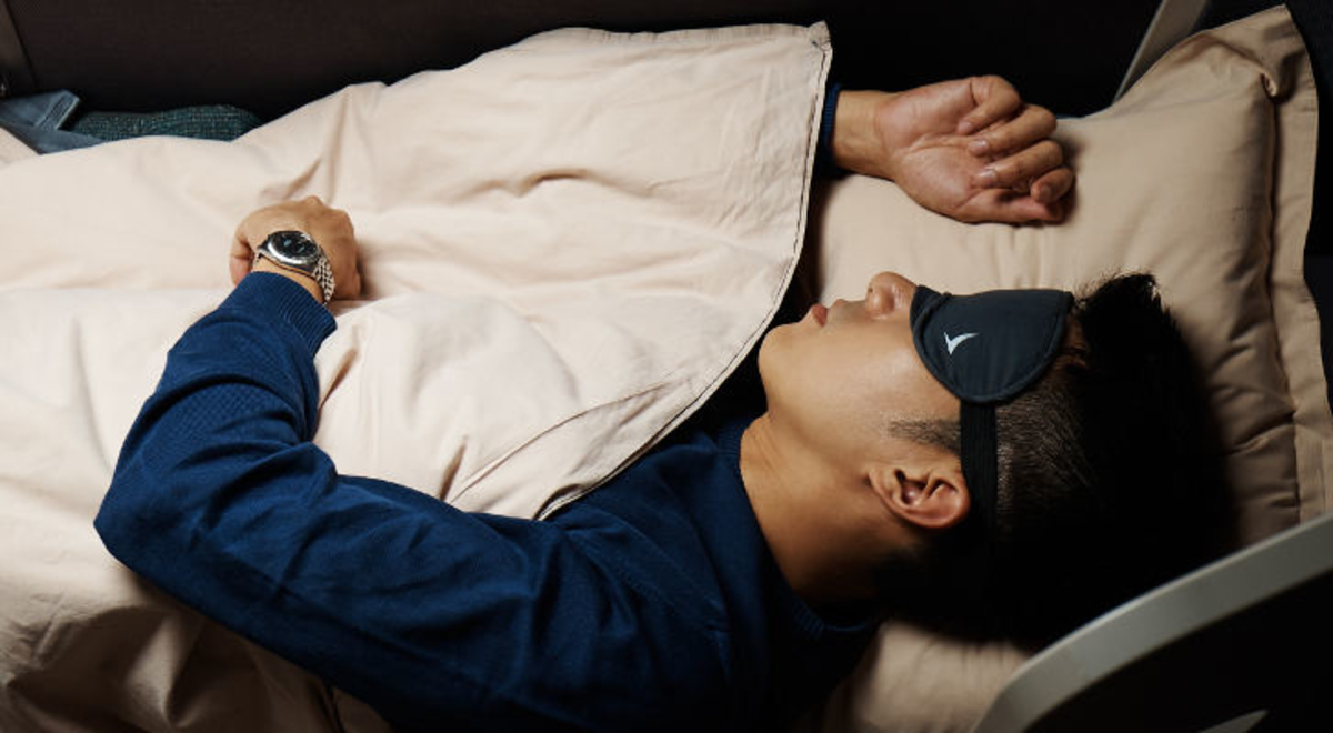 Cathay Pacific Business Class beds transform to full-flat for maximum comfort and rest.