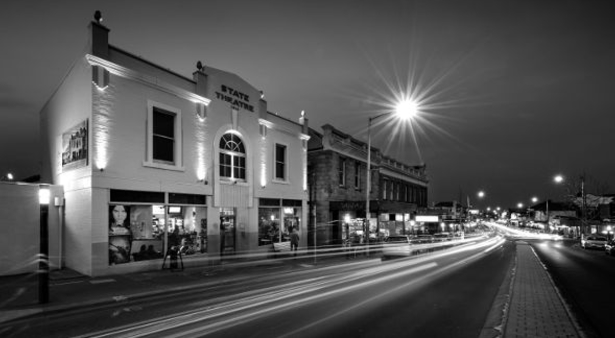 Black and white photo of a theater's façade